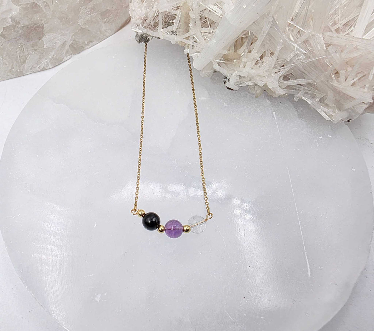 ESPACIO SAGRADO - Conjunto de joyas de cuarzo transparente, amatista y ónix negro
