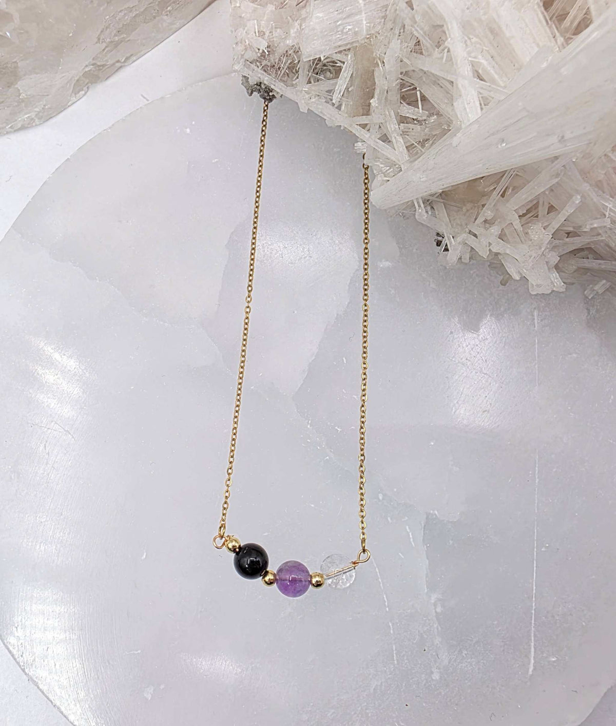 ESPACIO SAGRADO - Conjunto de joyas de cuarzo transparente, amatista y ónix negro