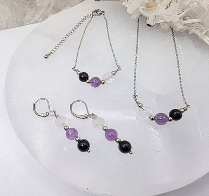 ESPACIO SAGRADO - Conjunto de joyas de cuarzo transparente, amatista y ónix negro
