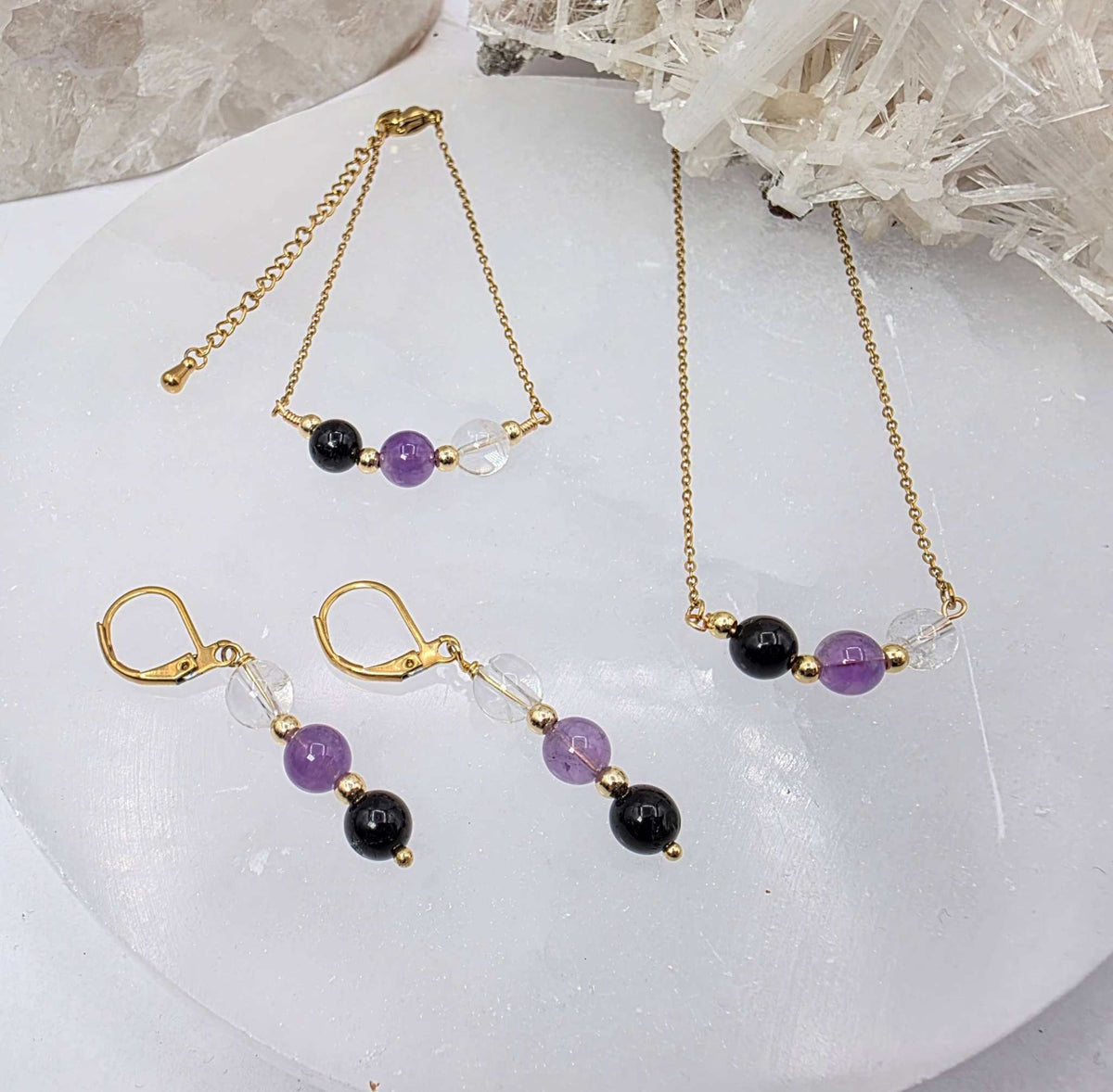 ESPACIO SAGRADO - Conjunto de joyas de cuarzo transparente, amatista y ónix negro