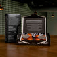 Roastworks coffee capsule packaging on a wooden surface with a dark background